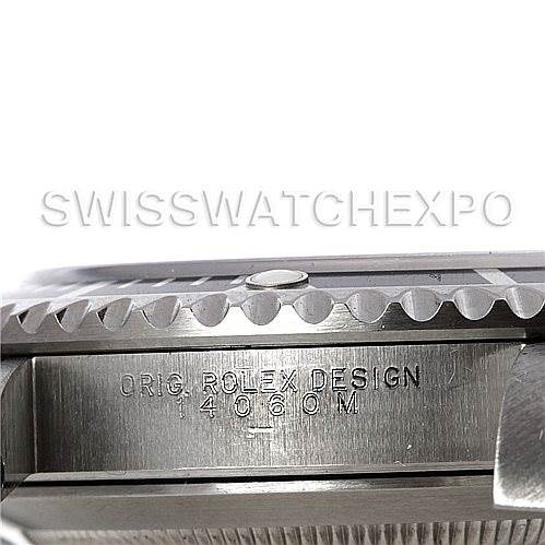 This image shows a side view of a Rolex Submariner 14060M Men's Stainless Steel Black Dial 14060M Men's Stainless Steel Black Dial, highlighting the engraved case with the "ORIG ROLEX DESIGN 14060M" inscription.