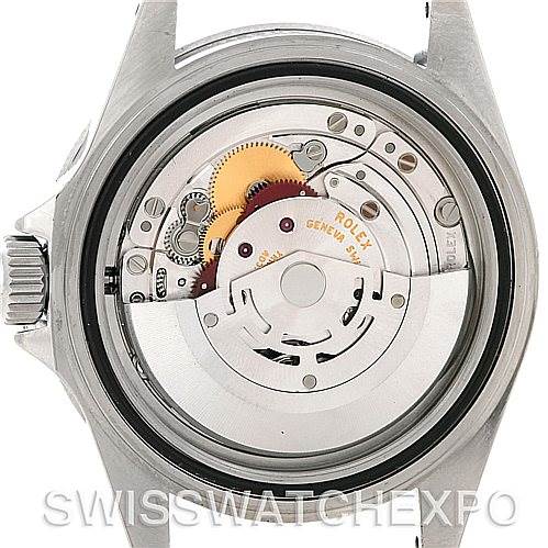 The image shows the back view of a Rolex Submariner 14060M Men's Stainless Steel Black Dial 14060M Men's Stainless Steel Black Dial watch, specifically displaying its intricate mechanical movement.