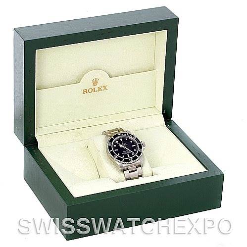 The Rolex Submariner 14060M Men's Stainless Steel Black Dial 14060M Men's Stainless Steel Black Dial watch is shown from the front and top angles inside its branded green and white box.