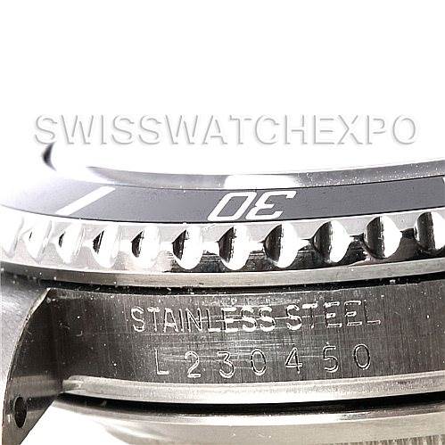 This image shows the side view of the bezel and the serial number on a Rolex Submariner 16610 Men's Stainless Steel Black Dial 16610 Men's Stainless Steel Black Dial watch.