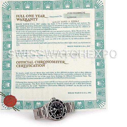 The image shows a Rolex Submariner 16610 Men's Stainless Steel Black Dial 16610 Men's Stainless Steel Black Dial watch positioned below its warranty and chronometer certification papers.
