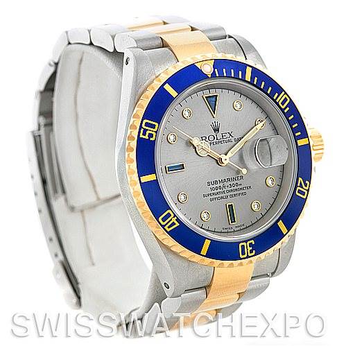 The image shows a Rolex Submariner 16613 Men's Steel and Gold (two tone) Grey Dial 16613 Men's Steel and Gold (two tone) Grey Dial watch from a front angle, highlighting the blue and gold bezel, dial, and bracelet.