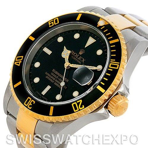 The image shows a Rolex Submariner 16613 Men's Steel and Gold (two tone) Black Dial 16613 Men's Steel and Gold (two tone) Black Dial watch at an angle highlighting its bezel, dial, crown, and part of the bracelet.