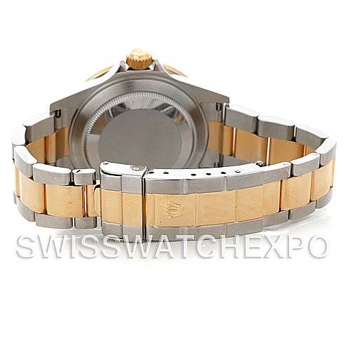 This image shows the backside and bracelet clasp of a Rolex Submariner 16613 Men's Steel and Gold (two tone) Black Dial 16613 Men's Steel and Gold (two tone) Black Dial watch, with a two-tone metal finish.