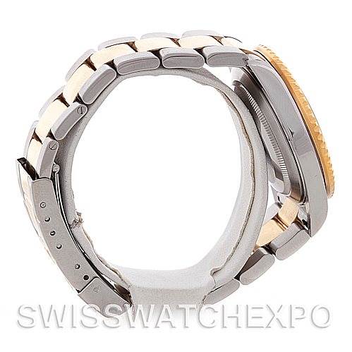 The image shows a side view of a Rolex Submariner 16613 Men's Steel and Gold (two tone) Black Dial 16613 Men's Steel and Gold (two tone) Black Dial, highlighting its bracelet and watch case, with a focus on the clasp and bezel.