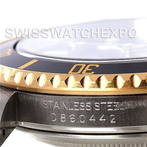 This close-up image shows the stainless steel case and bezel of a Rolex Submariner 16613 Men's Steel and Gold (two tone) Black Dial 16613 Men's Steel and Gold (two tone) Black Dial watch.