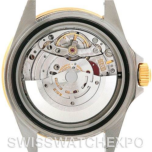This image shows the back view of the Rolex Submariner 16613 Men's Steel and Gold (two tone) Black Dial 16613 Men's Steel and Gold (two tone) Black Dial watch, highlighting its intricate internal movement and components.
