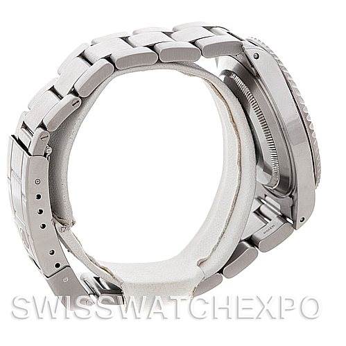 The image shows the side profile of a Cartier Tank Solo 14060 Men's Steel and Gold (two tone) Black Dial 14060 Men's Steel and Gold (two tone) Black Dial watch, highlighting its stainless steel bracelet and case.