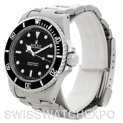 This image shows a Rolex Submariner watch from a side angle, highlighting the bezel, dial, crown, and stainless steel bracelet.