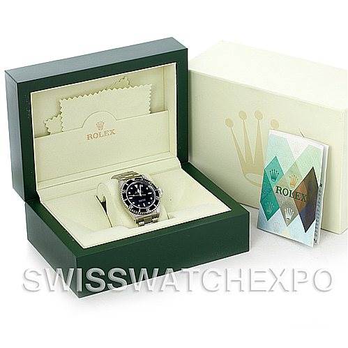 This image shows a Rolex watch and accessories, including a box, cleaning cloth, and booklet, not a Cartier Tank Solo 14060 Men's Steel and Gold (two tone) Black Dial 14060 Men's Steel and Gold (two tone) Black Dial model.