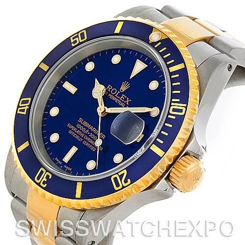 This image shows a side angle of the Rolex Submariner 16613 Men's Steel and Gold (two tone) Blue Dial 16613 Men's Steel and Gold (two tone) Blue Dial watch, highlighting the bezel, crown, dial, and part of the bracelet.