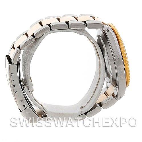 The image shows a side view of a Rolex Submariner 16613 Men's Steel and Gold (two tone) Blue Dial 16613 Men's Steel and Gold (two tone) Blue Dial watch, highlighting the bracelet, clasp, and partially the case and bezel.