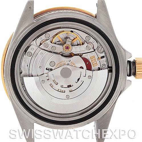 This image shows the back view of a Rolex Submariner 16613 Men's Steel and Gold (two tone) Blue Dial 16613 Men's Steel and Gold (two tone) Blue Dial watch case with its internal mechanical movement exposed.