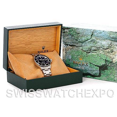 The image shows a Rolex Submariner 16610 Men's Stainless Steel Black Dial 16610 Men's Stainless Steel Black Dial watch placed in its open box, with the box lid displaying the Rolex logo and next to its outer box.