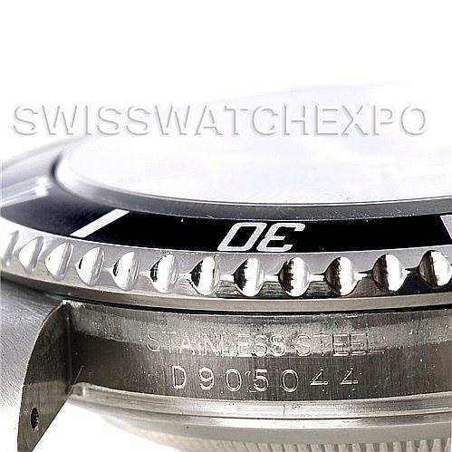 This close-up angle shows the bezel, part of the watch case, and the serial number of a Rolex Submariner 16610 Men
s Stainless Steel Black Dial 16610 Men
s Stainless Steel Black Dial.