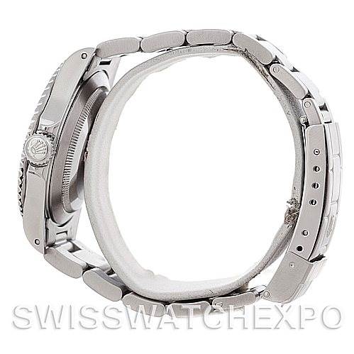 The image shows a side view of a Rolex Submariner 14060 Men's Stainless Steel Black Dial 14060 Men's Stainless Steel Black Dial, highlighting its bezel, crown, case, and stainless steel bracelet.