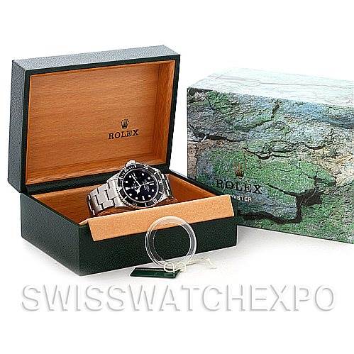 This image shows a Rolex Submariner 16610 Men's Stainless Steel Black Dial 16610 Men's Stainless Steel Black Dial watch inside its open box, with an additional outer box next to it.