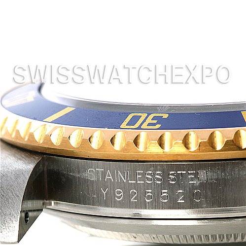 This image shows a side angle of the bezel and case of a Rolex Submariner 16613 Men's Steel and Gold (two tone) Blue Dial 16613 Men's Steel and Gold (two tone) Blue Dial watch, displaying the stainless steel and engraving.