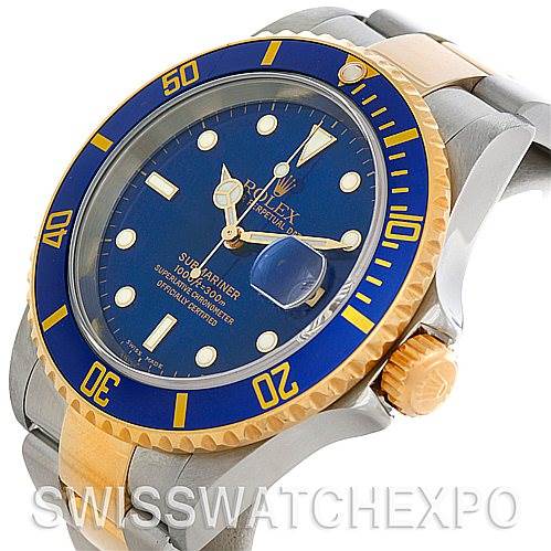 This image shows a Rolex Submariner 16613 Men's Steel and Gold (two tone) Blue Dial 16613 Men's Steel and Gold (two tone) Blue Dial watch at an angle, highlighting its blue dial, bezel, the crown, and part of the bracelet.
