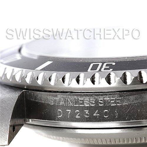 The image shows a close-up angle of the bezel, case, and serial number of a Rolex Submariner 16610 Men's Stainless Steel Black Dial 16610 Men's Stainless Steel Black Dial watch.