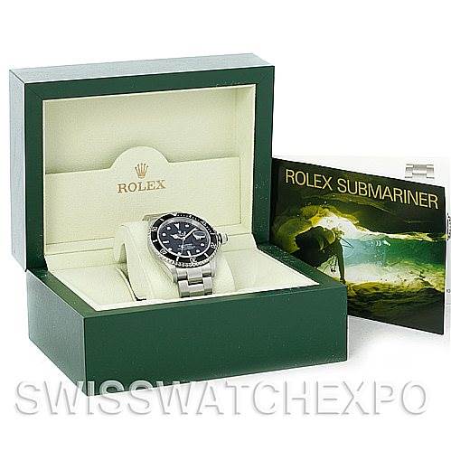 The image shows a Rolex Submariner 16610 Men's Stainless Steel Black Dial 16610 Men's Stainless Steel Black Dial watch in its green display box, accompanied by a booklet.