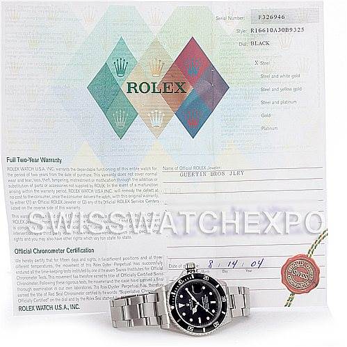 The image shows a Rolex Submariner 16610 Men's Stainless Steel Black Dial 16610 Men's Stainless Steel Black Dial watch laying flat with its certificate and warranty paperwork behind it.