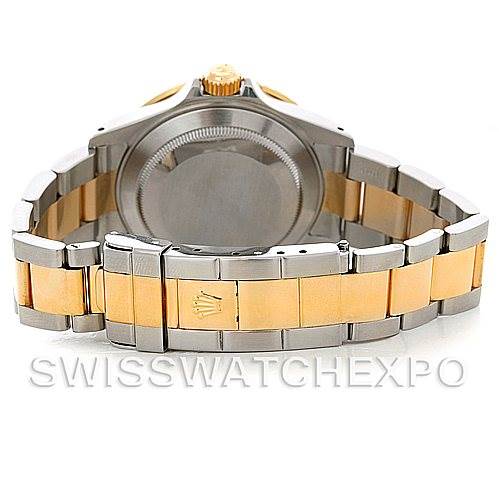 The image shows the back case and bracelet of a Rolex Submariner 16613 Men's Steel and Gold (two tone) Black Dial 16613 Men's Steel and Gold (two tone) Black Dial watch, highlighting the two-tone metal design.