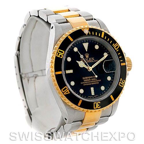 This image shows a side and front angle of a Rolex Submariner 16613 Men's Steel and Gold (two tone) Black Dial 16613 Men's Steel and Gold (two tone) Black Dial watch, highlighting its bezel, dial, and two-tone bracelet.