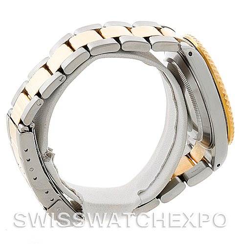 The image shows a side view of the Rolex Submariner 16613 Men's Steel and Gold (two tone) Black Dial 16613 Men's Steel and Gold (two tone) Black Dial, highlighting its two-tone bracelet and the edge of the case.