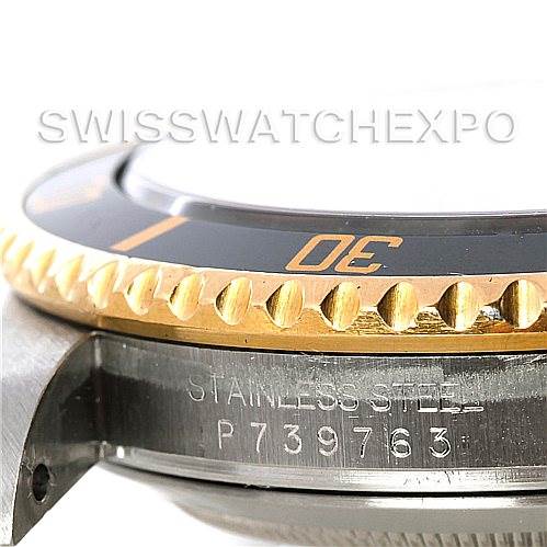 The image shows a close-up angle of the bezel and case side, with the serial number engraved on the Rolex Submariner 16613 Men's Steel and Gold (two tone) Black Dial 16613 Men's Steel and Gold (two tone) Black Dial watch.