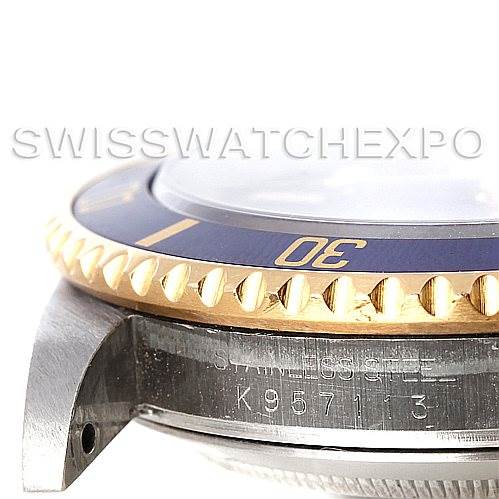 The image shows a close-up side view of a Rolex Submariner 16613 Men's Steel and Gold (two tone) Blue Dial 16613 Men's Steel and Gold (two tone) Blue Dial watch, highlighting the bezel, part of the crystal, and the stainless steel case.