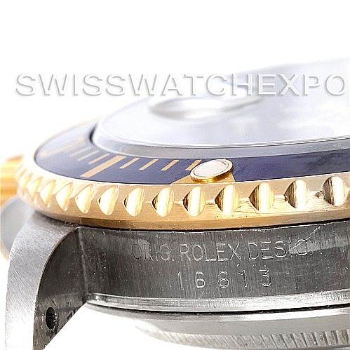 The image shows a close-up side angle of the case, bezel, and crystal of a Rolex Submariner 16613 Men's Steel and Gold (two tone) Blue Dial 16613 Men's Steel and Gold (two tone) Blue Dial, revealing the model number "16613."
