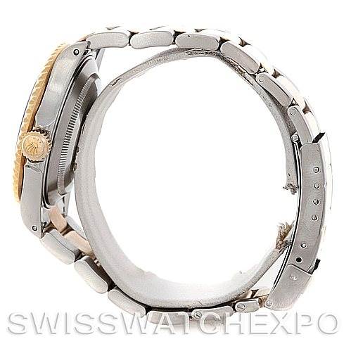 The image shows a side profile of a Rolex Submariner 16613 Men's Steel and Gold (two tone) Blue Dial 16613 Men's Steel and Gold (two tone) Blue Dial watch, highlighting the crown, case, and bracelet.