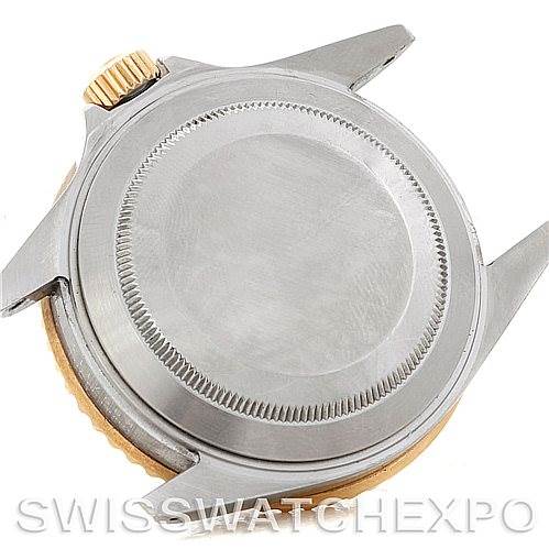 The image shows the back casing and crown of a Rolex Submariner 16613 Men's Steel and Gold (two tone) Blue Dial 16613 Men's Steel and Gold (two tone) Blue Dial watch, focusing on the rear and side parts.