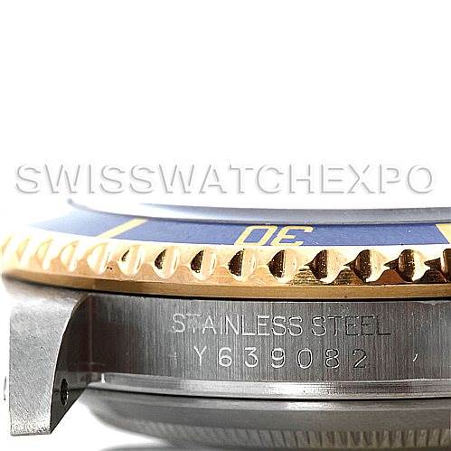 This image shows a close-up side view of a Rolex Submariner 16613 Men's Steel and Gold (two tone) Grey Dial 16613 Men's Steel and Gold (two tone) Grey Dial watch, focusing on the bezel and part of the case with a serial number.