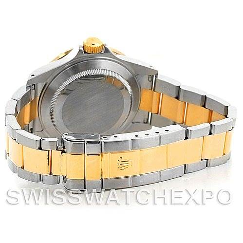The image shows the back view of a Rolex Submariner 16613 Men's Steel and Gold (two tone) Grey Dial 16613 Men's Steel and Gold (two tone) Grey Dial watch, highlighting its two-tone bracelet and clasp with the Rolex logo.