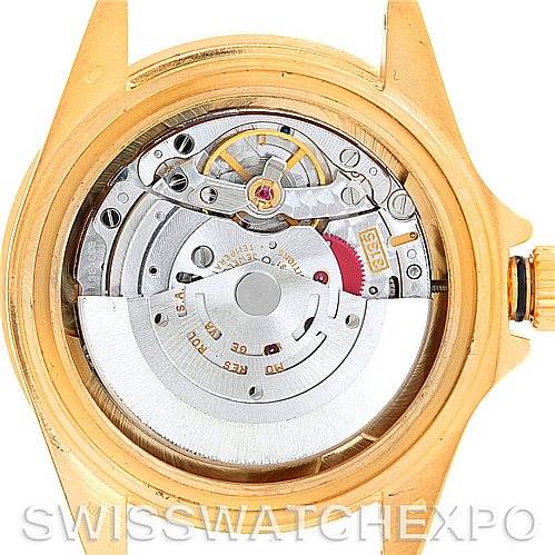 The image shows the open case back revealing the movement of a Rolex Submariner 16618 Men's Yellow Gold Champagne Dial 16618 Men's Yellow Gold Champagne Dial watch.