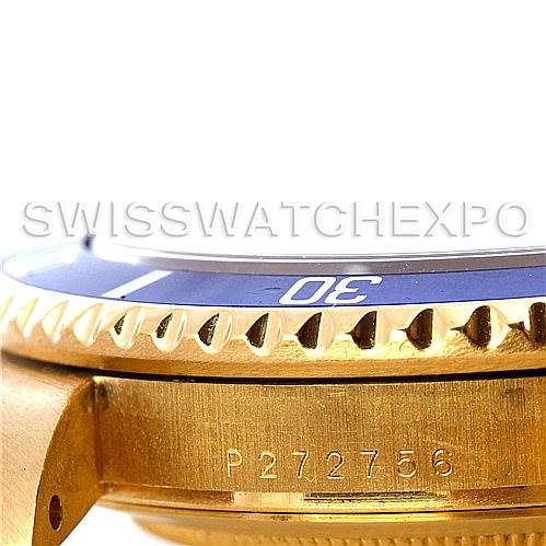 Side view of a Rolex Submariner 16618 Men's Yellow Gold Champagne Dial 16618 Men's Yellow Gold Champagne Dial showing a portion of the bezel and case, with the serial number engraved on the side.
