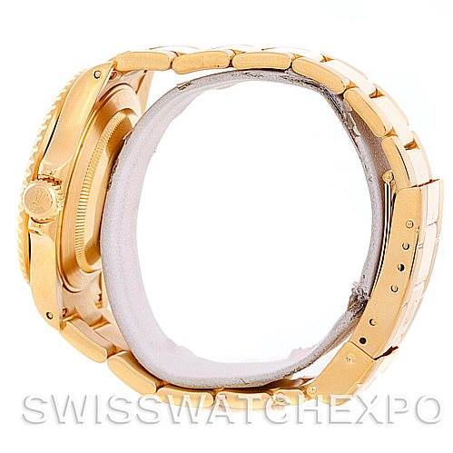 The image shows a side view of a Rolex Submariner 16618 Men's Yellow Gold Champagne Dial 16618 Men's Yellow Gold Champagne Dial watch highlighting its gold case and bracelet.