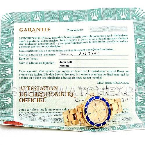 The image shows a Rolex Submariner 16618 Men's Yellow Gold Champagne Dial 16618 Men's Yellow Gold Champagne Dial watch laid flat, with a focus on the watch and its official warranty and certification papers in the background.