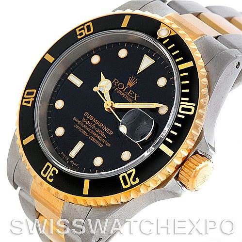 The image shows a Rolex Submariner 16613 Men's Steel and Gold (two tone) Black Dial 16613 Men's Steel and Gold (two tone) Black Dial watch at an angled side view, highlighting its black dial, gold bezel, and two-tone bracelet.