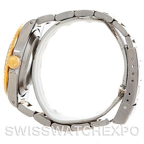 This image shows the side view of a Rolex Submariner 16613 Men's Steel and Gold (two tone) Black Dial 16613 Men's Steel and Gold (two tone) Black Dial watch, highlighting its bracelet, case, and crown.