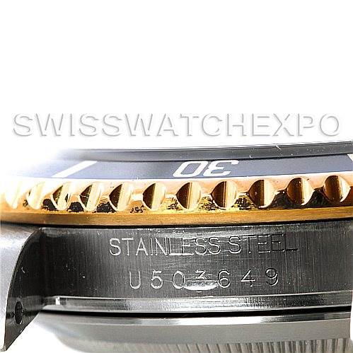 This image shows a close-up side view of the bezel, stainless steel case, and serial number of the Rolex Submariner 16613 Men's Steel and Gold (two tone) Black Dial 16613 Men's Steel and Gold (two tone) Black Dial watch.