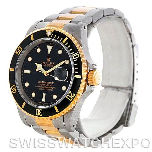 The Rolex Submariner 16613 Men's Steel and Gold (two tone) Black Dial 16613 Men's Steel and Gold (two tone) Black Dial watch is shown at an oblique angle, displaying its black dial, gold bezel, and two-tone metal bracelet.