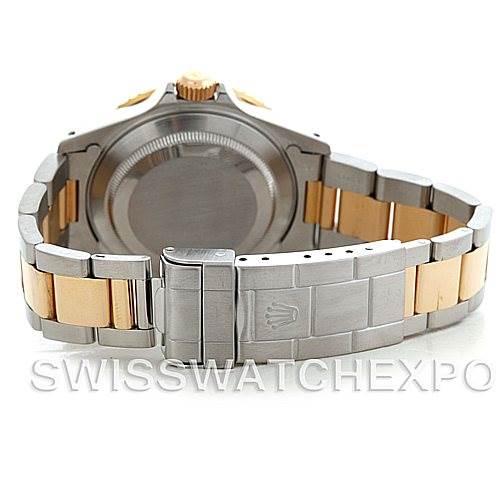 This image shows the back view of a Rolex Submariner 16613 Men's Steel and Gold (two tone) Black Dial 16613 Men's Steel and Gold (two tone) Black Dial watch, highlighting the case back and two-tone bracelet.