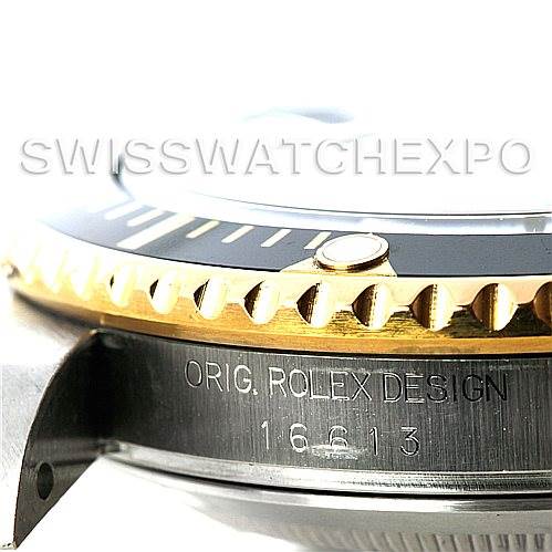 This image shows a close-up view of the side of a Rolex Submariner 16613 Men's Steel and Gold (two tone) Black Dial 16613 Men's Steel and Gold (two tone) Black Dial watch, highlighting the bezel and engraved model number, 16613.