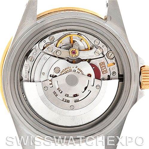 This image shows the open case back of a Rolex Submariner 16613 Men's Steel and Gold (two tone) Black Dial 16613 Men's Steel and Gold (two tone) Black Dial watch, revealing its internal mechanical movement.