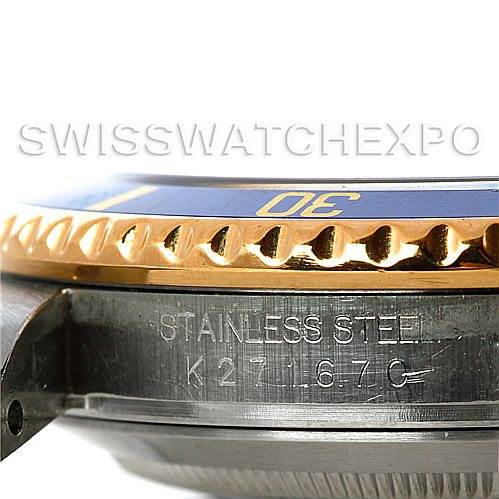 The image shows a close-up, side view of the Rolex Submariner 16613 Men's Steel and Gold (two tone) Blue Dial 16613 Men's Steel and Gold (two tone) Blue Dial watch, highlighting its stainless steel case and bezel.