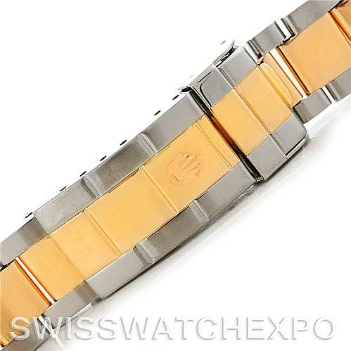 This image shows a close-up angle of the bi-metal bracelet of a Rolex Submariner 16613 Men's Steel and Gold (two tone) Blue Dial 16613 Men's Steel and Gold (two tone) Blue Dial, highlighting the clasp with the Rolex logo.