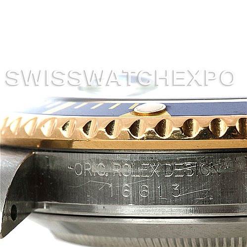 The image shows a close-up, side angle of a Rolex Submariner 16613 Men's Steel and Gold (two tone) Blue Dial 16613 Men's Steel and Gold (two tone) Blue Dial model, focusing on the bezel and part of the case with the model number.